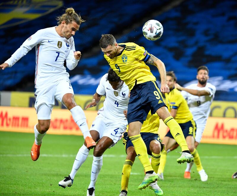France's Antoine Griezmann in action against Sweden's Marcus Berg. EPA