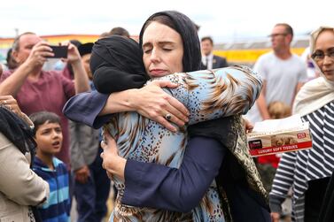 New Zealand Prime Minister Jacinda Ardern embraces a woman outside the Kilbirnie Mosque in Wellington on Sunday, after the attacks on two mosques in Christchurch last Friday. Getty 