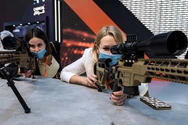 Visitors look at some UAE firepower by Caracal at Idex 2021 . Victor Besa / The National 