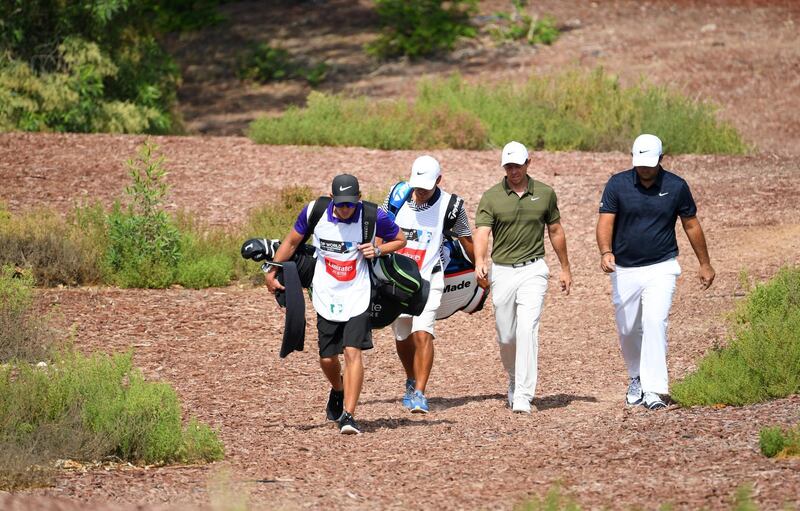 DUBAI, UNITED ARAB EMIRATES - NOVEMBER 16:  Rory McIlroy of Northern Ireland and Patrick Reed of the United States walk off the 2nd tee during day two of the DP World Tour Championship at Jumeirah Golf Estates on November 16, 2018 in Dubai, United Arab Emirates.  (Photo by Ross Kinnaird/Getty Images)