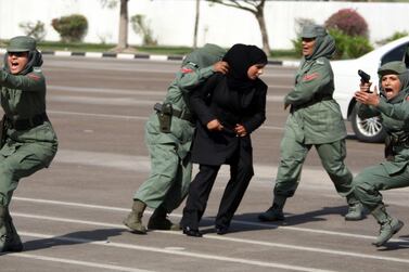 Dubai elite policewomen squad for VIPs show their skills during a graduation ceremony. AFP