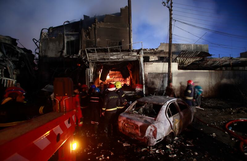 The building in Baghdad’s northern district of Waziriyah was used as a warehouse for oil-based perfumes. AP