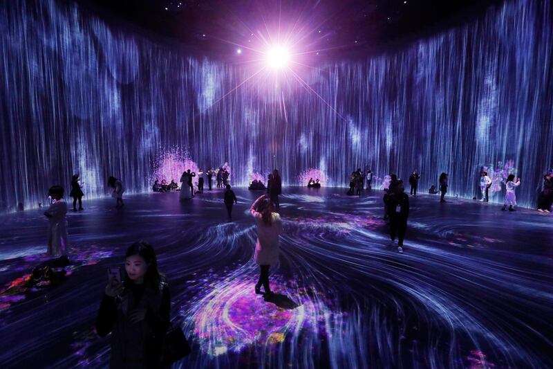 People visit the art show 'Universe of Water Particles in the Tank' by teamLab at Tank Shanghai art space project in Shanghai, China. EPA