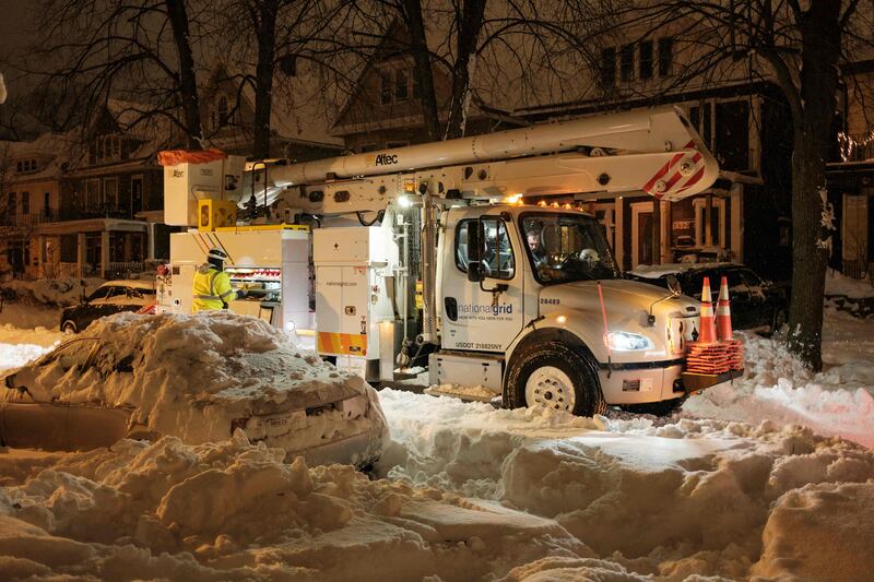 National Grid technicians work to restore power in a part of Buffalo. AFP