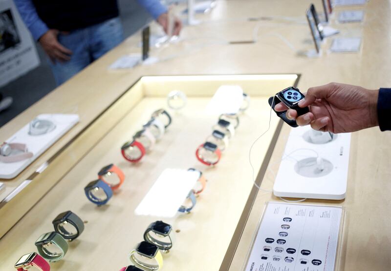 A shopper holds an Apple Watch at a store in Mexico. Reuters