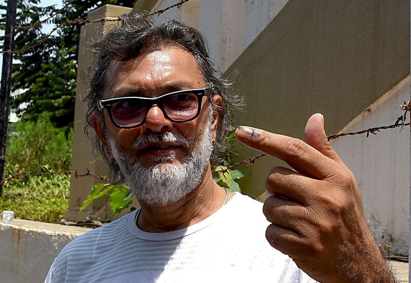 Indian filmmaker and screenwriter Rakesh Omprakash Mehra poses for photographs after casting his vote at a polling station in Mumbai on April 29, 2019. AFP