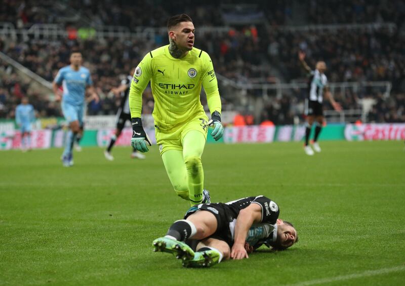 Newcastle's Ryan Fraser after being brought down by City goalkeeper Ederson but no penalty was given. Reuters