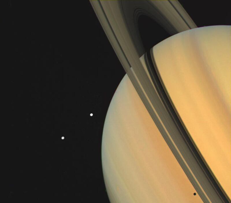 A picture of Saturn taken by the Voyager spacecraft in 1980. Taken from a distance of 13 million kilometres, it shows the planet’s moons, Tethys and Dione. Photo: Nasa