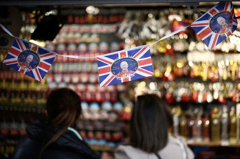 People browse a souvenir kiosk in London. Reuters