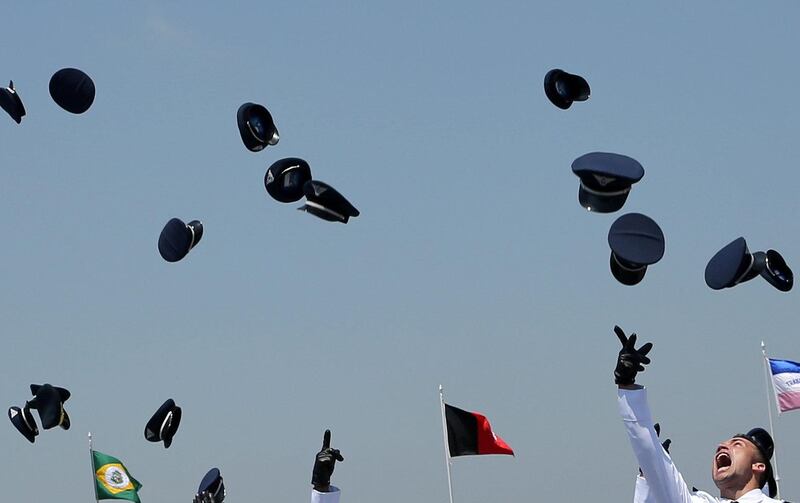 Air force officers throw their caps in the air, as they celebrate after their graduation ceremony, at the Brazilian Air Force Academy (AFA) in Pirassununga, Brazil. Reuters