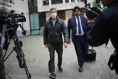 Chung Biu Yuen leaves Westminster Magistrates' Court, central London, where he was freed on bail after appearing on charges under the National Security Act. PA 