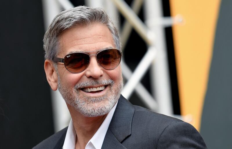 (FILES) In this file photo taken on May 13, 2019 US actor and film director George Clooney poses during a photocall of the Catch-22 TV show in Rome. Hollywood star and activist George Clooney on June 11, 2019 urged the international community to go after illicit money from Sudan, voicing hope that financial pressure would change the calculus for generals who violently put down pro-democracy protests.Clooney -- a longtime campaigner for human rights in Sudan's western region of Darfur -- noted that the notorious Janjaweed militias were involved both in abuses in Darfur and in putting down demonstrations last week.
 / AFP / Tiziana FABI
