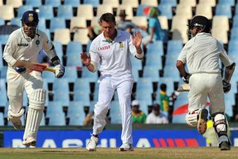 Dale Steyn reacts as Virender Sehwag, left, and Gautam Gambhir take a run off him at Centurion. Alexander Joe / AFP