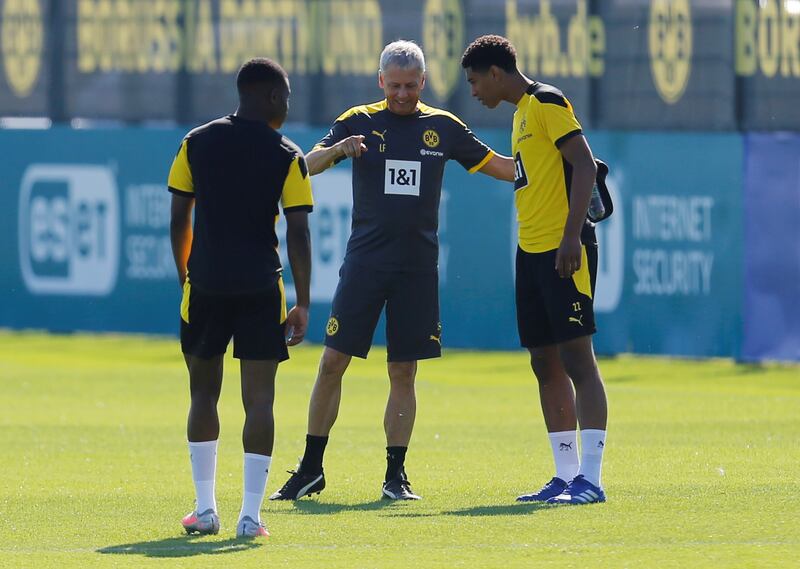 Borussia Dortmund manager Lucien Favre with Jude Bellingham during training. Reuters