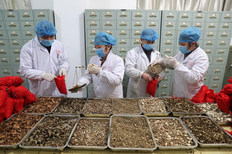 Medical workers of a traditional Chinese medicine (TCM) hospital prepare TCM sachets as the country is hit by an outbreak of the novel coronavirus, in Fuzhou, Jiangxi province, China. REUTERS