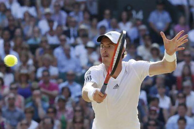 Andy Murray of Britain returns to Novak Djokovic of Serbia during the men's final at Wimbledon.