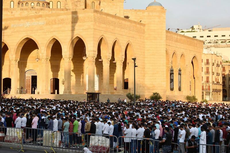 Muslims perform Eid Al Adha prayers in front of the Muhammad al-Amin Mosque in downtown Beirut, Lebanon.  EPA