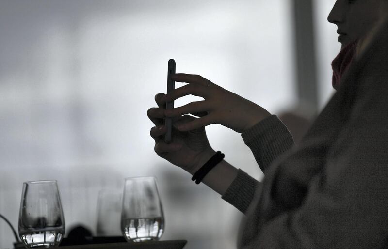 13 March 2019, Berlin: A woman is filming with a smartphone. Photo: Jens Kalaene/dpa-Zentralbild/ZB (Photo by Jens Kalaene/picture alliance via Getty Images)