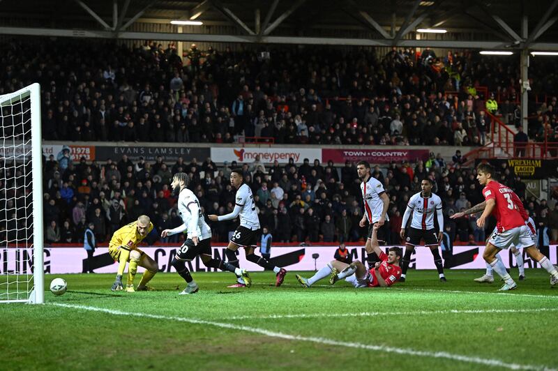 James Jones scores for Wrexham to make it 1-1. AFP