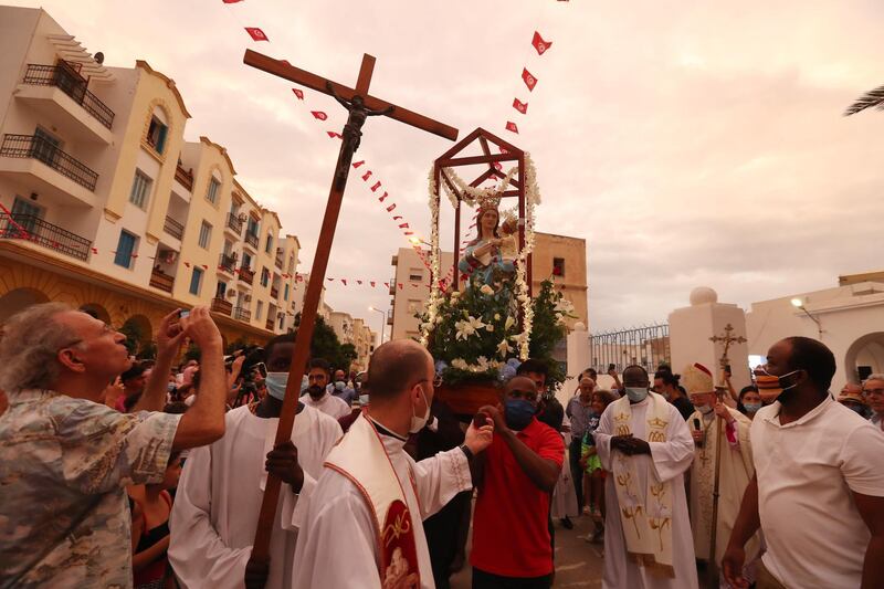 Members of the Christian community attend Mass during a procession of the Madonna of Trapani at the Saint-Augustin church in La Goulette in Tunis, Tunisia.  EPA