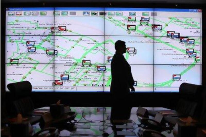 Siraj Ismail, enterprise risk manager, shows the water taxi and bus routes on the screen during a meeting at RTA’s Crisis Operations Centre in Dubai. Pawan Singh / The National