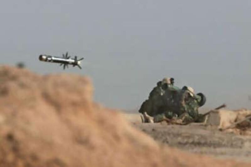 US Marines fire a shoulder-launched Javelin missile during a battle with Iraqi troops at the port in Umm Qasr, Iraq in 2003. Two US weapons makers have won a contract to produce Javelins for the UAE and Oman.