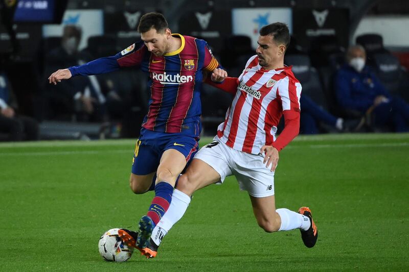 Athletic Bilbao's Dani Garcia challenges Lionel Messi. AFP