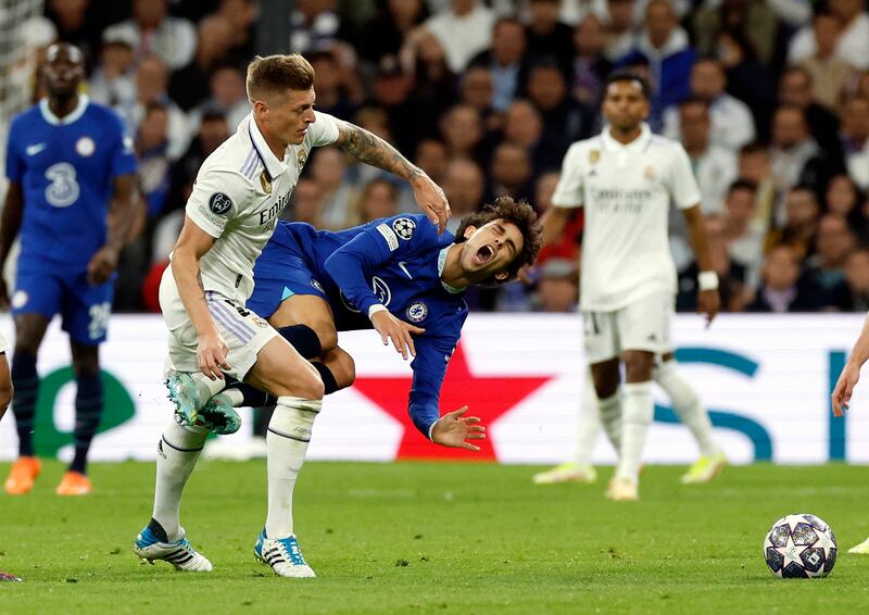 Real Madrid's Toni Kroos tangles with Chelsea's Joao Felix. Reuters
