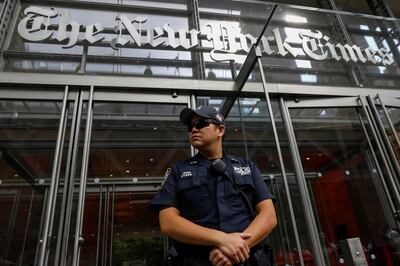 A New York Police officer is seen deployed outside the New York Times building following a fatal shooting at a Maryland newspaper, in New York City, U.S., June 28, 2018.  REUTERS/Brendan McDermid
