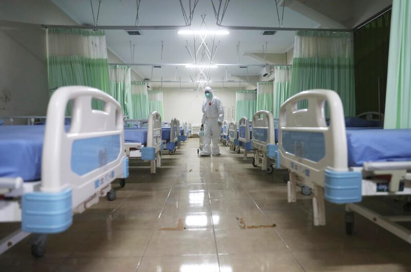 A medic inspects makeshift isolation rooms at Patriot Candrabhaga stadium for people with Covid-19 symptoms in Bekasi, on the outskirts of Jakarta, Indonesia. AP Photo
