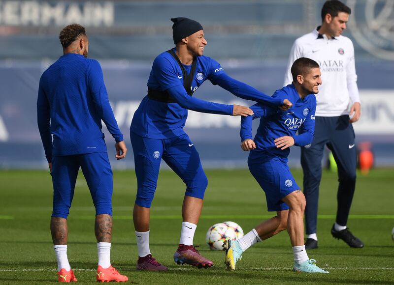 PSG forward Kylian Mbappe jokes with Marco Verratti, right, during a training session at the club's Camp des Loges training ground. AFP