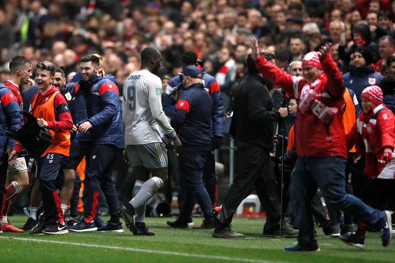 Manchester United's Romelu Lukaku leaves the field as Bristol City fans celebrate. David Klein / Reuters