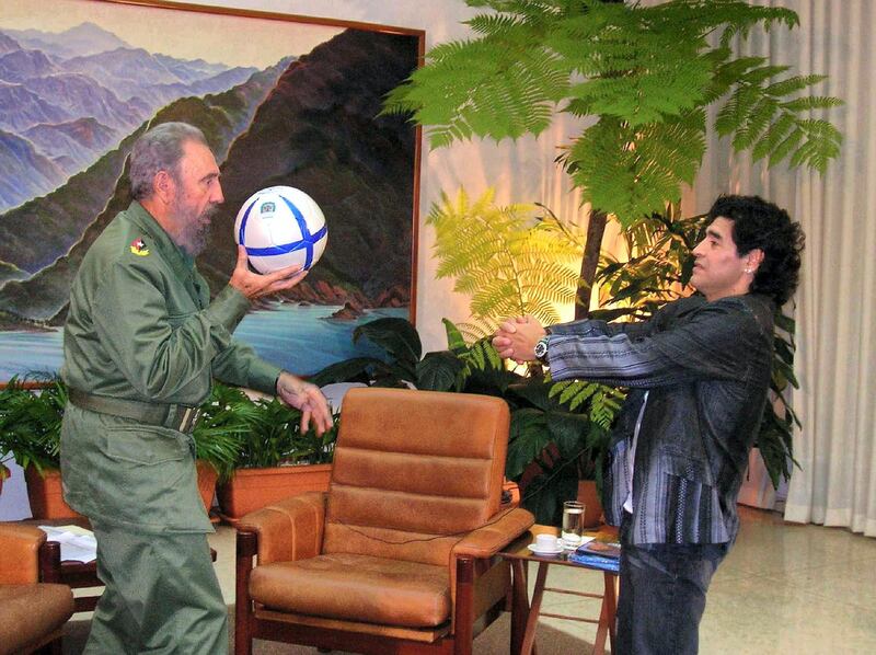 Photograph handed out by Argentine Canal 13 of Cuban President Fidel Castro (L) playing with a football with Argentinian ex soccer star Diego Armando Maradona, during the recording of Maradona's TV program "The 10's Night" in Havana, 26 October 2005. Maradona's weekly program will be broadasted 31 October 2005 in Buenos Aires. AFP PHOTO/CANAL 13 (Photo by HO / CANAL 13 / AFP)