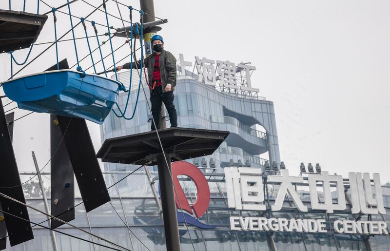 An amusement park in front of the Evergrande building in Shanghai. The developer has been plunged into crisis since Beijing began to clamp down on the country's property sector last year. EPA