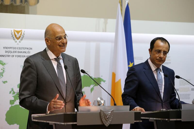 epa08610811 Cypriot Foreign Minister Nikos Christodoulides (R) and Greek Foreign Minister Nikos Dendias (L) hold a joint news conference following their meeting at the Ministry of Foreign Affairs in Nicosia, Cyprus, 18 August 2020.  EPA/KATIA CHRISTODOULOU