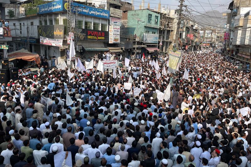 Residents take part in a protest a day after an attack on a school bus in Mingora, Pakistan. More than 5,000 people blocked a main road after the latest attack on a school bus on October 10, in which the driver was killed and child wounded. AFP
