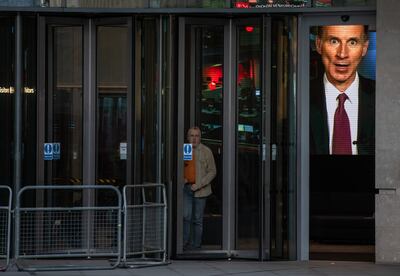 UK Chancellor of the Exchequer Jeremy Hunt is seen on a television screen at BBC Broadcasting House on Saturday. Getty Images