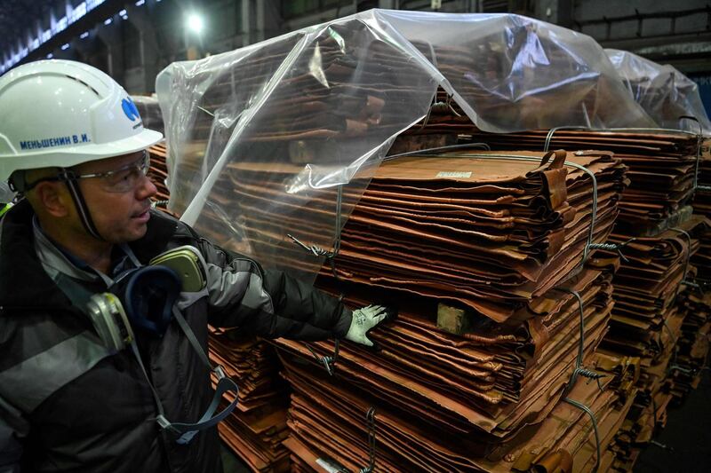 (FILES) In this file photo taken on February 25, 2021 A view shows copper sheets at Kola Mining and Metallurgical Company (Kola MMC), a unit of Russia's metals and mining company Nornickel, in the town of Monchegorsk in the Murmansk region. The price of a tonne of copper exceeded $10,000 on April 29, 2021, for the first time since February 2011 thanks to strong demand in China and the weak dollar. / AFP / Kirill KUDRYAVTSEV

