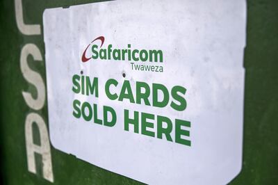 A sign advertises the sale of Safaricom Ltd. sim cards stands on the wall of a street vendor in Mombasa, Kenya, on Thursday, Nov. 23, 2017. The country’s Treasury has already cut this year’s growth target to 5 percent from 5.9 percent as the protracted election furor damped investment and a drought curbed farm output. Photographer: Luis Tato/Bloomberg