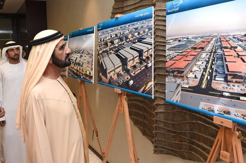Sheikh Mohammed bin Rashid looks at the plans for Dubai Wholesale City. Courtesy Wam