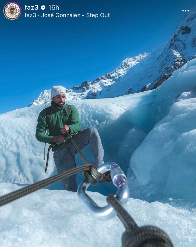 Sheikh Hamdan climbs down a glacier hole.