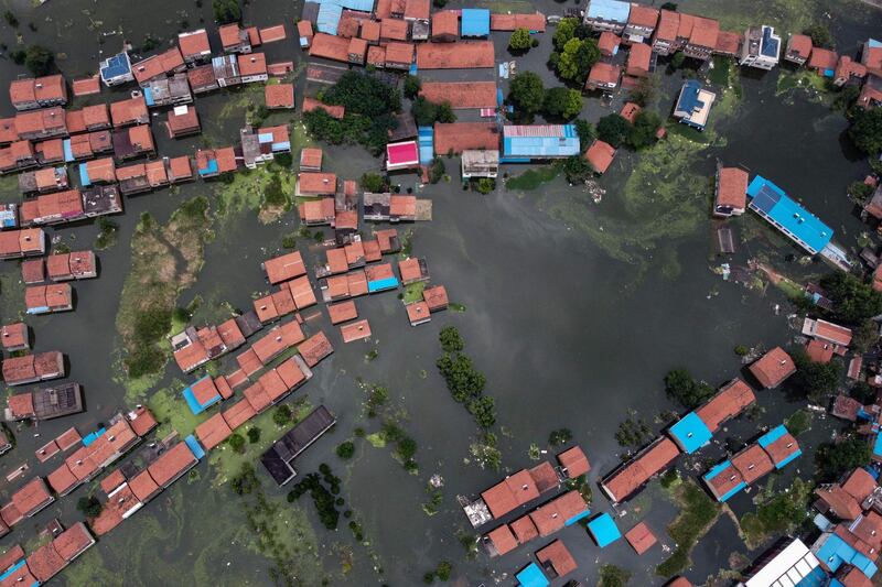 An aerial view shows flooded residential buildings due to rising water levels of the Yangtze river in Jiujiang, China's central Jiangxi province. AFP