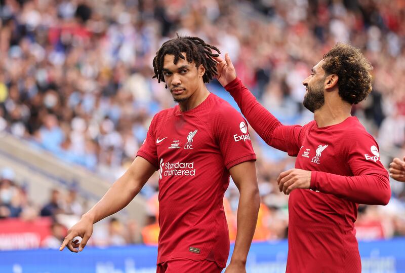 Liverpool's Trent Alexander-Arnold with teammate Mohamed Salah. Getty