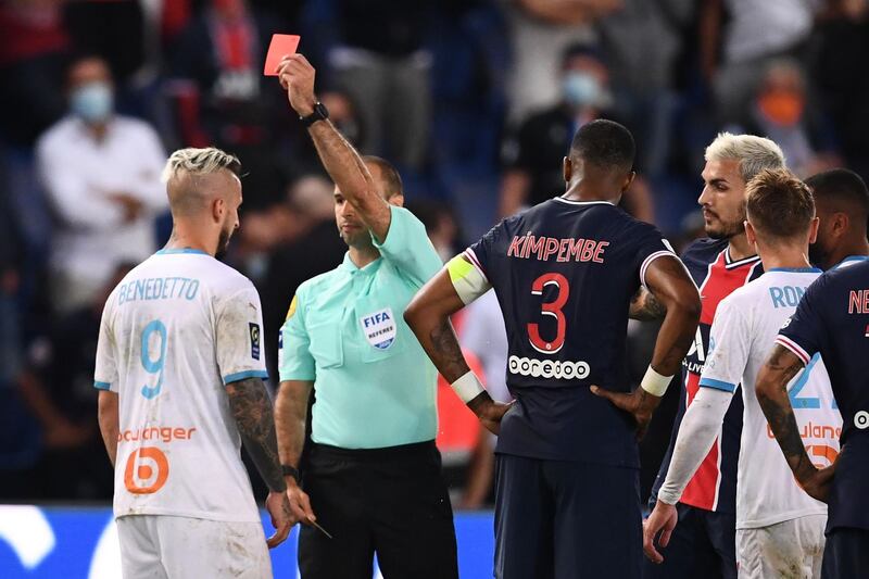 Marseille's Argentinian forward Dario Benedetto, left, and Paris Saint-Germain's Argentinian midfielder Leandro Paredes, second right, receive red cards. AFP