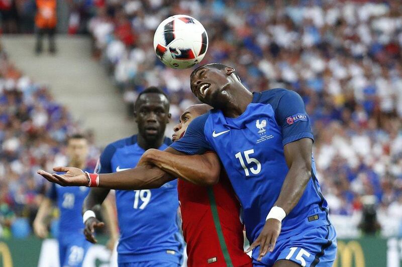 Portugal’s Joao Mario in action with France’s Paul Pogba and Bacary Sagna during the Uefa Euro 2016 Final at the Stade de France, 10 July 2016. Michael Dalder / Reuters