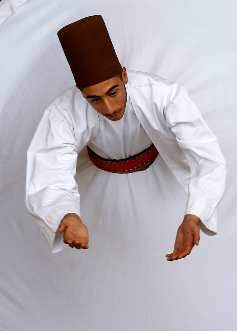 A Sufi Dervish dancer of the Al Kharrat family performs a routine. AFP
