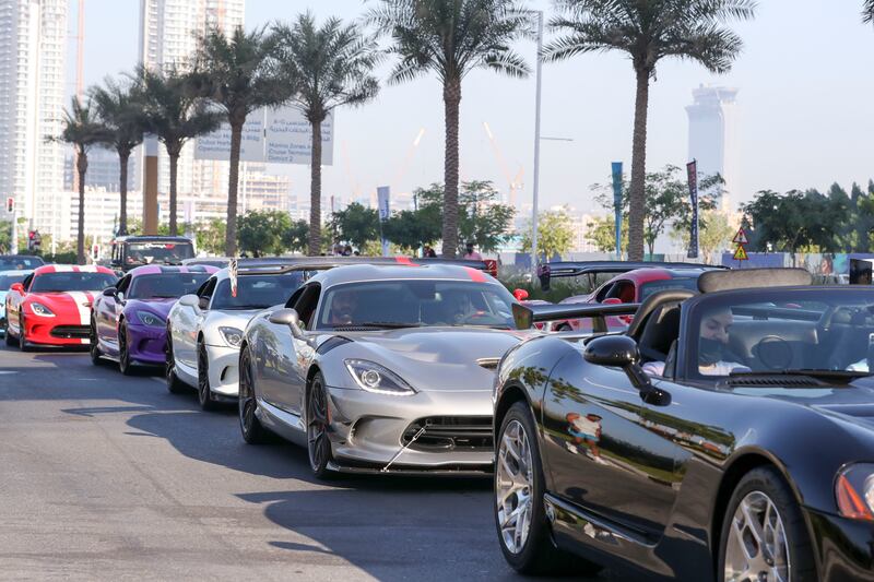 A line-up of luxury marques as part of the parade. Khushnum Bhandari / The National