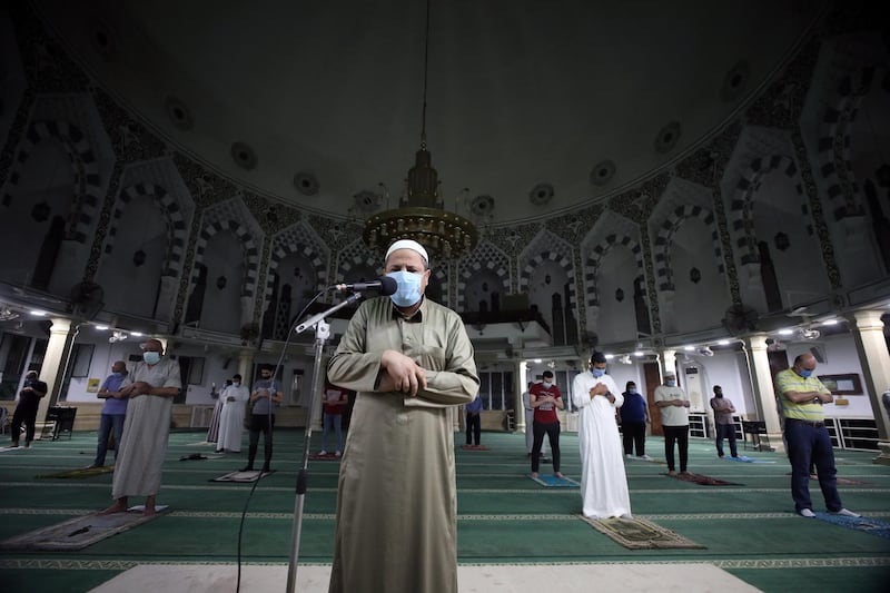 People pray while observing safe distancing at the Al Emam Aly Mosque in Cairo.  EPA