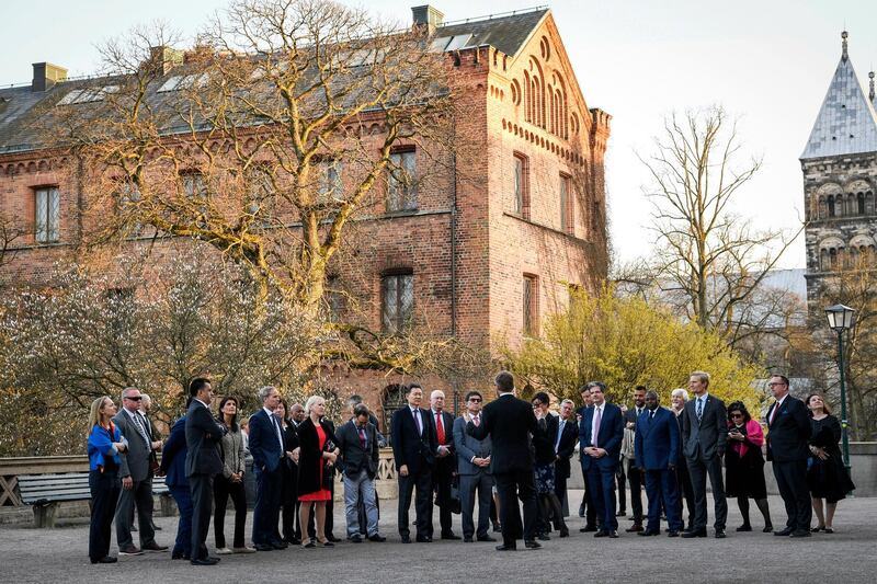 The ambassadors to the United Nations of the Security Council pause during a walk in Lund, Sweden on Friday, April 20, 2018. The annual informal working meeting with the UN Secretary-General and the Security Council will be held at Dag Hammarskjold's farm Backakra in Skane, southern Sweden on Saturday. (Johan Nilsson/TT News Agency via AP)