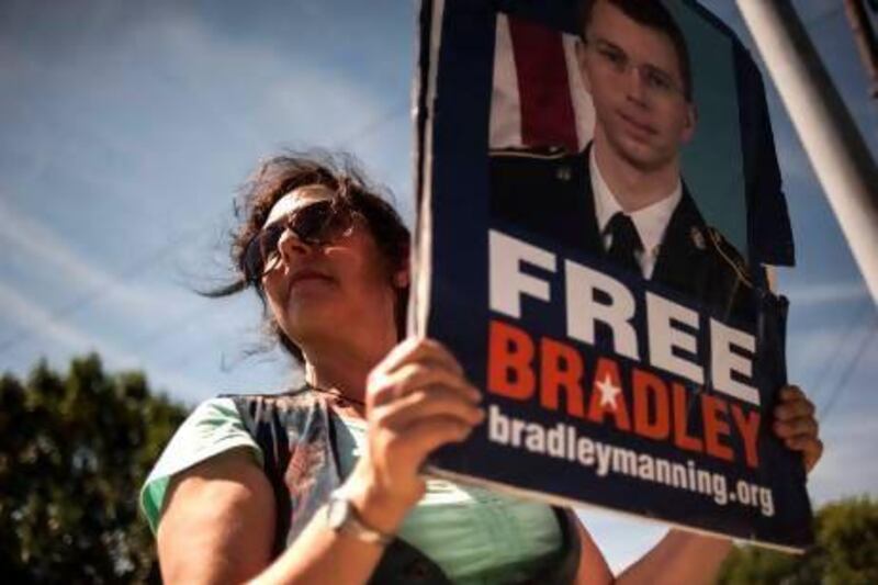 A supporter of Bradley Manning protests outside the main gate before the reading of the verdict in Manning's military trial at Fort Meade, Maryland.